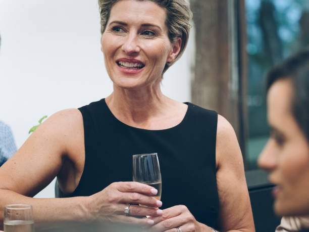 istock business people talking and drinking at bar 894833686