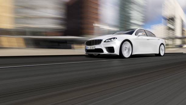 istock car driving on urban road 894846222
