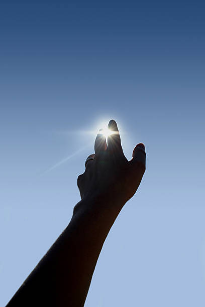 istock Silhouette of hand sheltering the sun demonstrating future 89485069