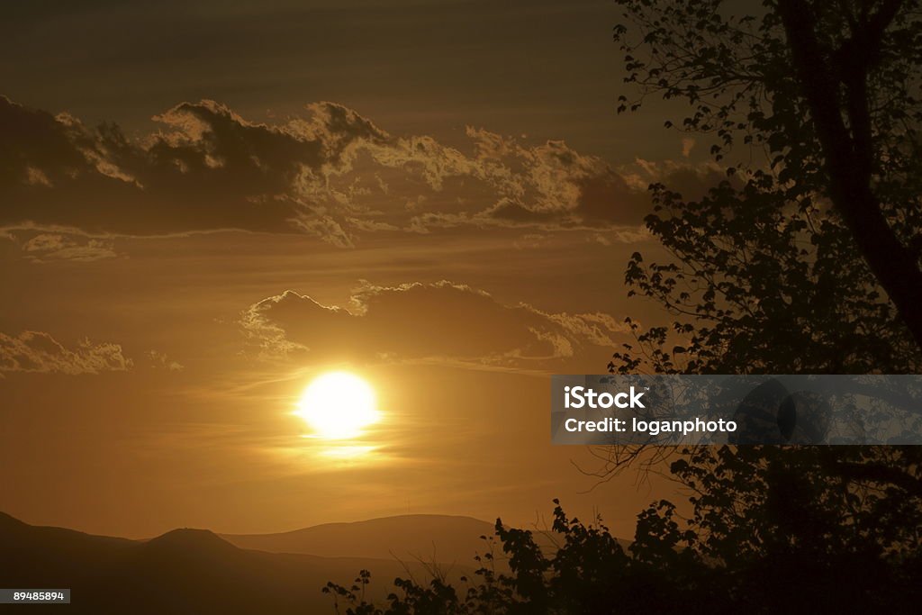 Sunset Through Clouds  Cloud - Sky Stock Photo