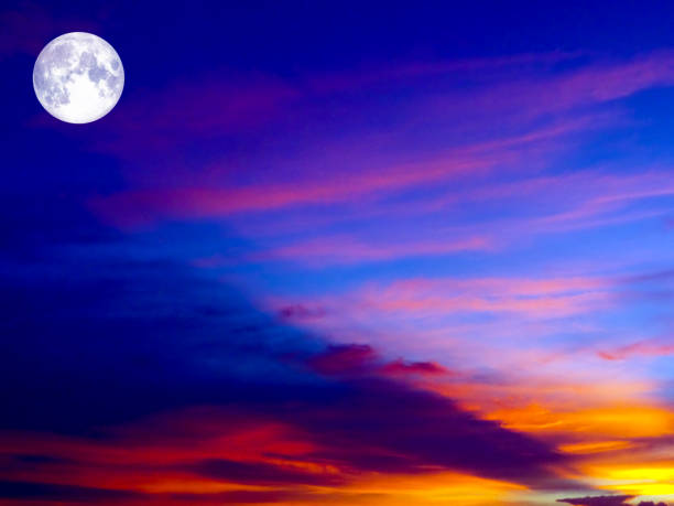 istock full moon on colorful sky orange red dark gray cloud 894864998
