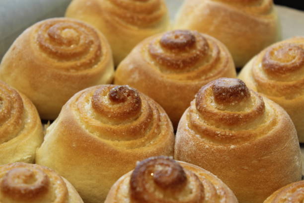 istock Homemade baking. Buns with iced sugar. 894865056
