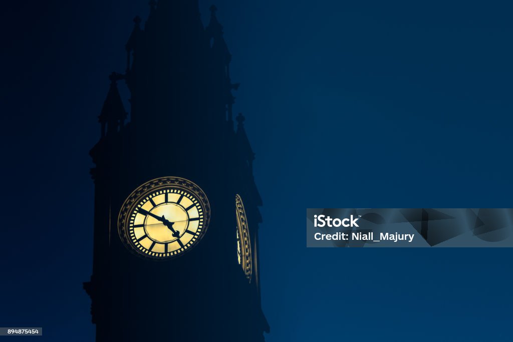 Clock face reading 4.50pm against dusk sky The facade of the Albert Memorial Clock (1869), Belfast, Northern Ireland.  A public memorial, it is located at Queen's Square.  The memorial was erected to mark the life of Prince Albert (1819-1861). It was designed by W J Barre and constructed in 1870.  The clock was made by Francis Moore. 1860-1869 Stock Photo