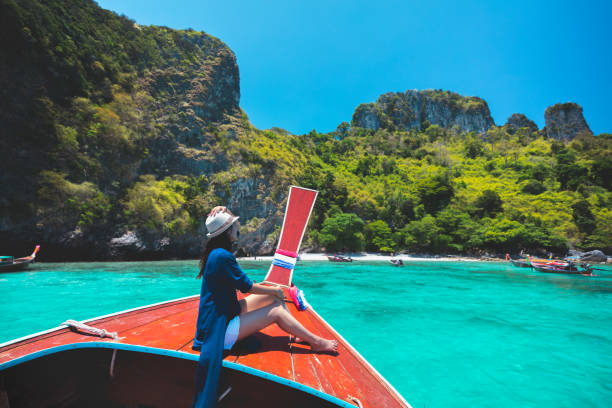 Happy female traveling on boat