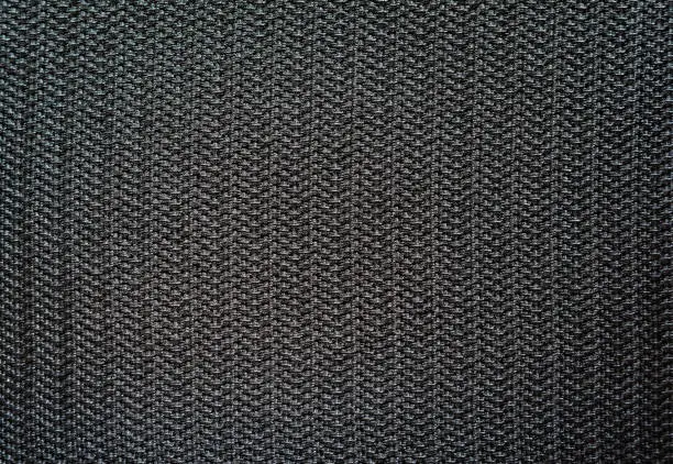 Velcro texture. Black fabric background. Extreme close-up.