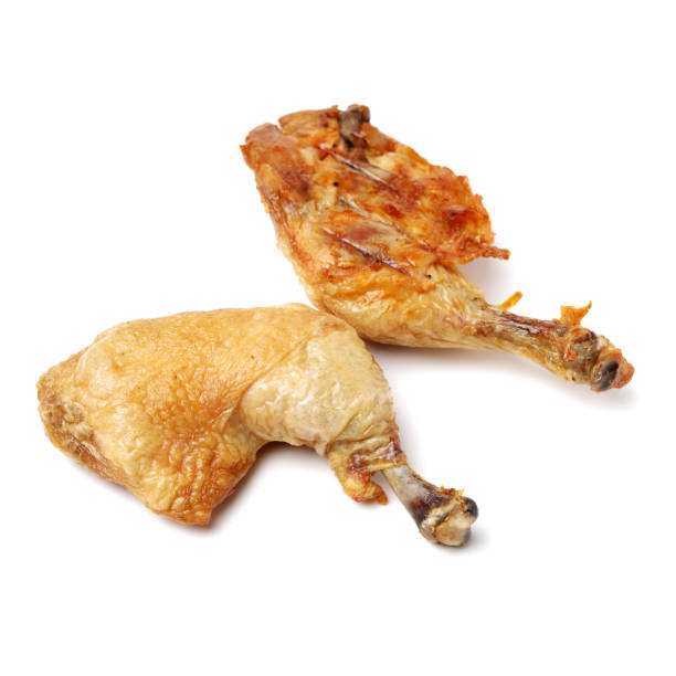 istock Roasted duck legs on the white background 894935224