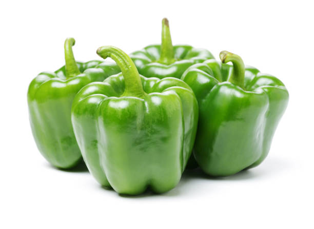istock Isolated green capsicum couple   on white background 894943026