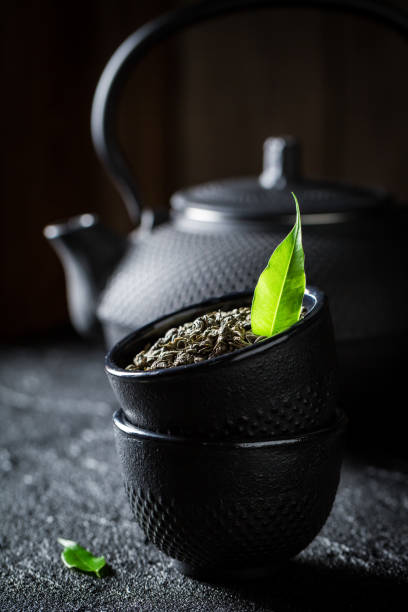 istock Closeup of green tea in a teacup 894943840