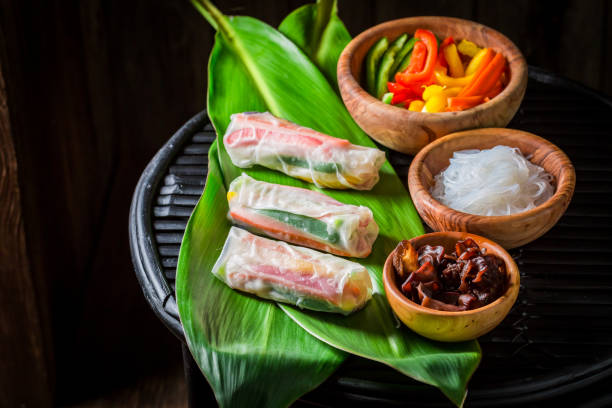 istock Preparing spring rolls with sweet and sour sauce 894949210