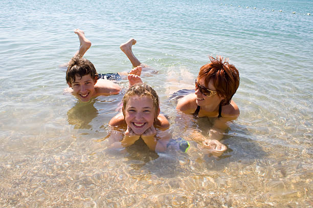 istock Children with mother on the beach 89495130