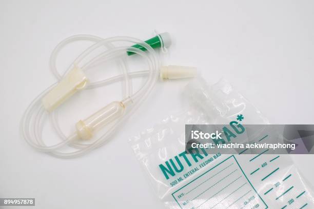 Nutrients Line And Nutrients Bag Feeding For Patient On White Background Stock Photo - Download Image Now