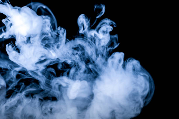 Orange dust cloud isolated on black background, realistic powder explosion texture for design overlay, sand or smoke particle effect, abstract motion with warm cinematic atmosphere.