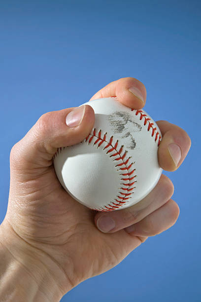 istock Closeup of Left Hand Holding Two Seam Grip on Baseball 89497044