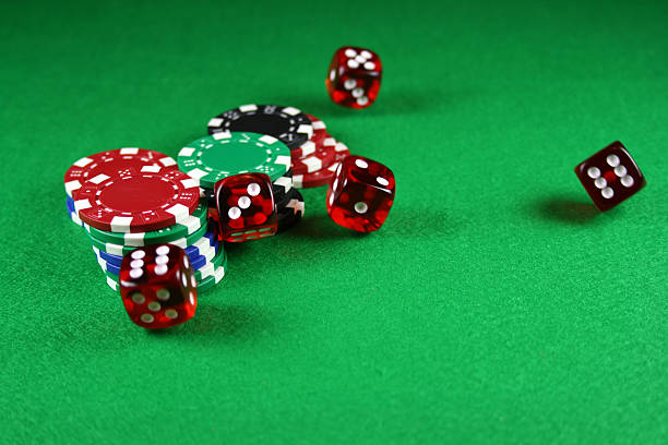 istock Action shot of 5 dice thrown onto the table 89497296