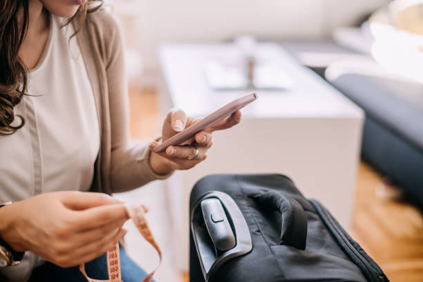 istock Woman buying plane ticket on phone. 894974526