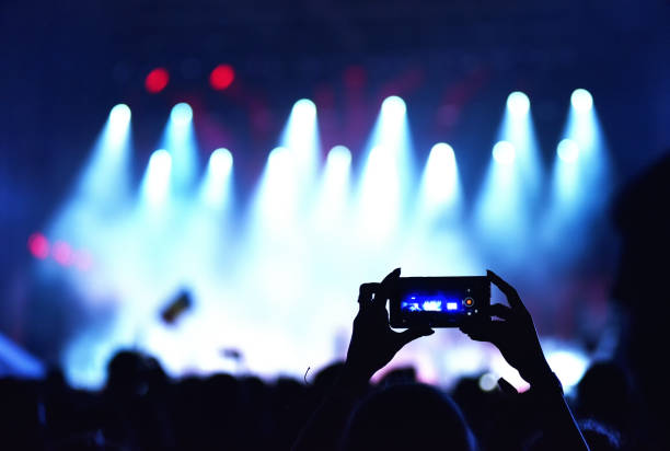 istock Crowd recording live concert with smart phones 894974906