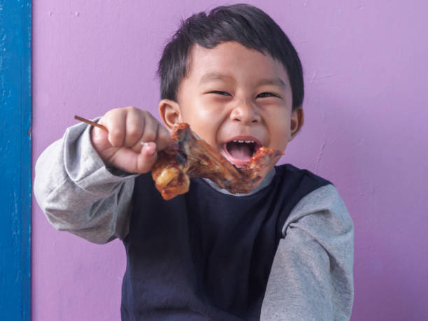 asian boy eating. - eating child cracker asia imagens e fotografias de stock