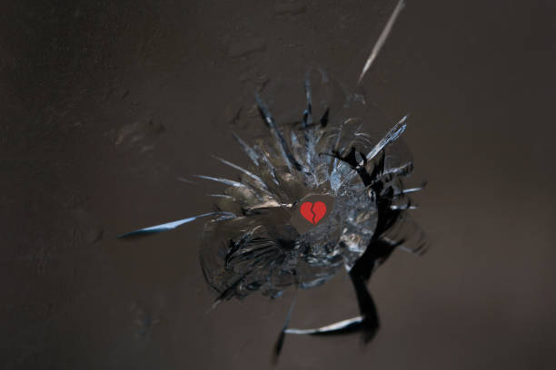 Broken glass. Hole, cracks in the window from the fragment of the projectile. Background, texture