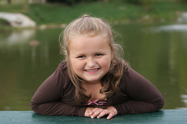istock Giggly girl in front of pond 89498311