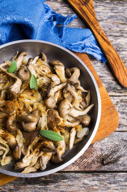 istock Fried oyster mushrooms with onions 894983824