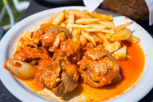 istock Stifado with fries on the plate 894986874