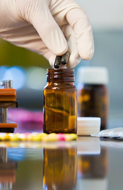 istock Chemist Producing Drugs or Medicine With Reflection 89499662