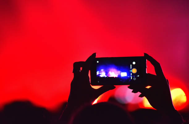 istock Crowd recording live concert with smart phones 895000342