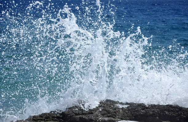 istock Sea waves crushing the shore 895000768