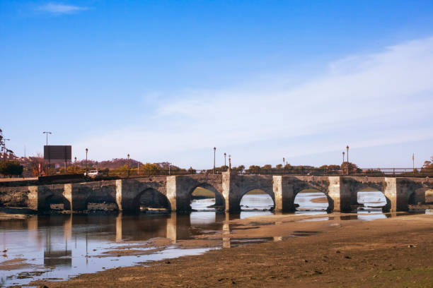 Old romanesque stone bridge in A Ramallosa, Pontevedra province, Galicia, Spain.