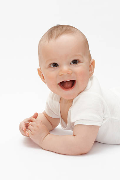 istock Laughing baby lying on the floor 89500124