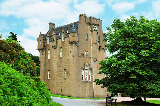 istock Scottish castle between the trees in summer day 89500147