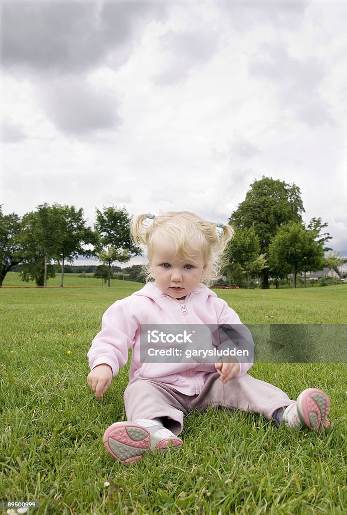 sitting on grass  18-23 Months Stock Photo