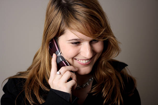 Young woman with mobile phone stock photo