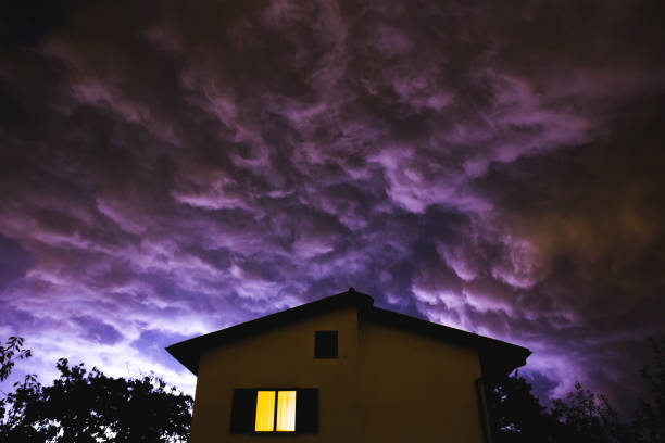 Panoramic shot of dramatic storm clouds over the house,Italy