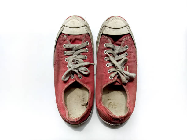 Red shoes is dirty on white background