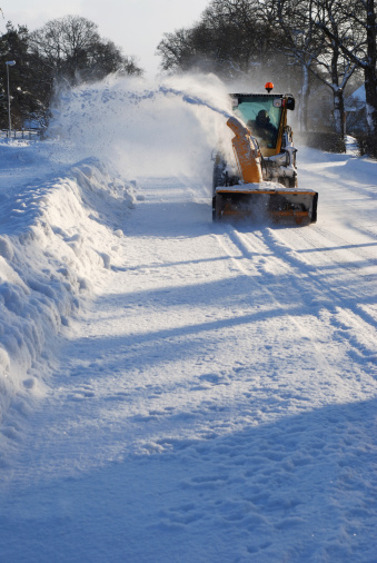 Snow machine cleaning the roads