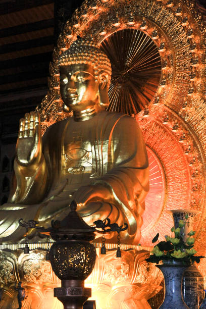 istock beautiful architecture building golden Buddhism Statue 895023574