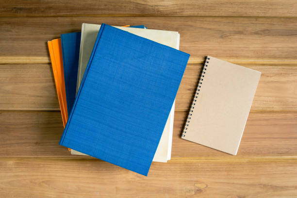 istock mock up book on desk wood 895023760