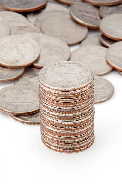 Stacking quarters stock photo