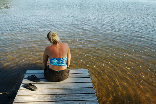 istock Woman On The Dock at Peaceful Lake 89502822