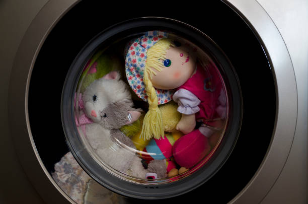 Washing machine door with rotating toys inside