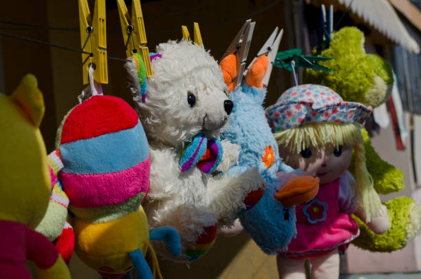 istock Funny toys hanging on the line 895028714