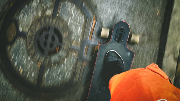 istock Longboarder driving on the street 895030844