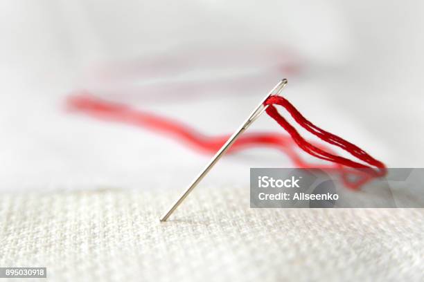 Needle In Canvas With Red Thread For Embroidery Embroidery Macro Close Up  View From Above Free Copy Space Stock Photo - Download Image Now - iStock