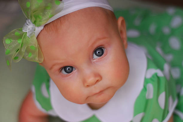 Little baby girl crawling and playing at home.