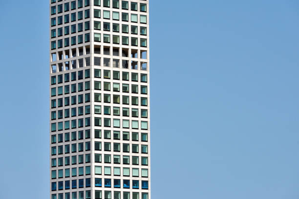 istock View of modern skyscraper against blue sky 895036398