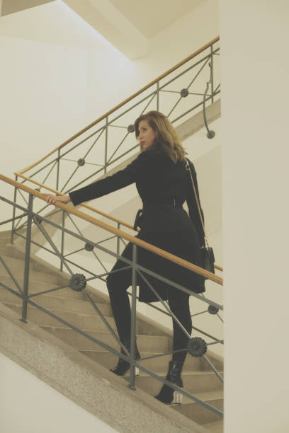 istock Young woman on stairs 895038886