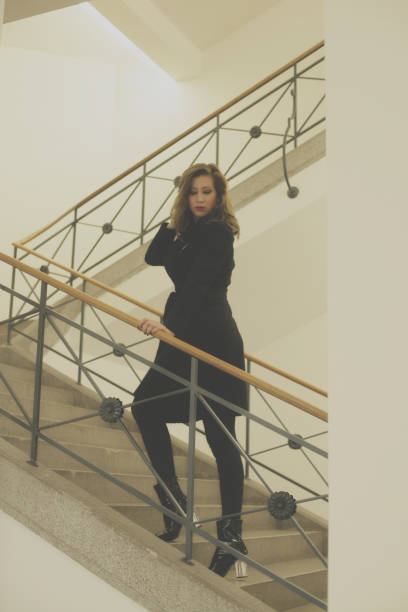 istock Young woman on stairs 895038896