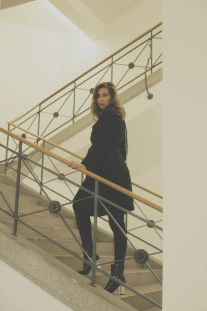 istock Young woman on stairs 895038986