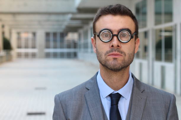 istock Clever male with very thick eyeglasses 895039054